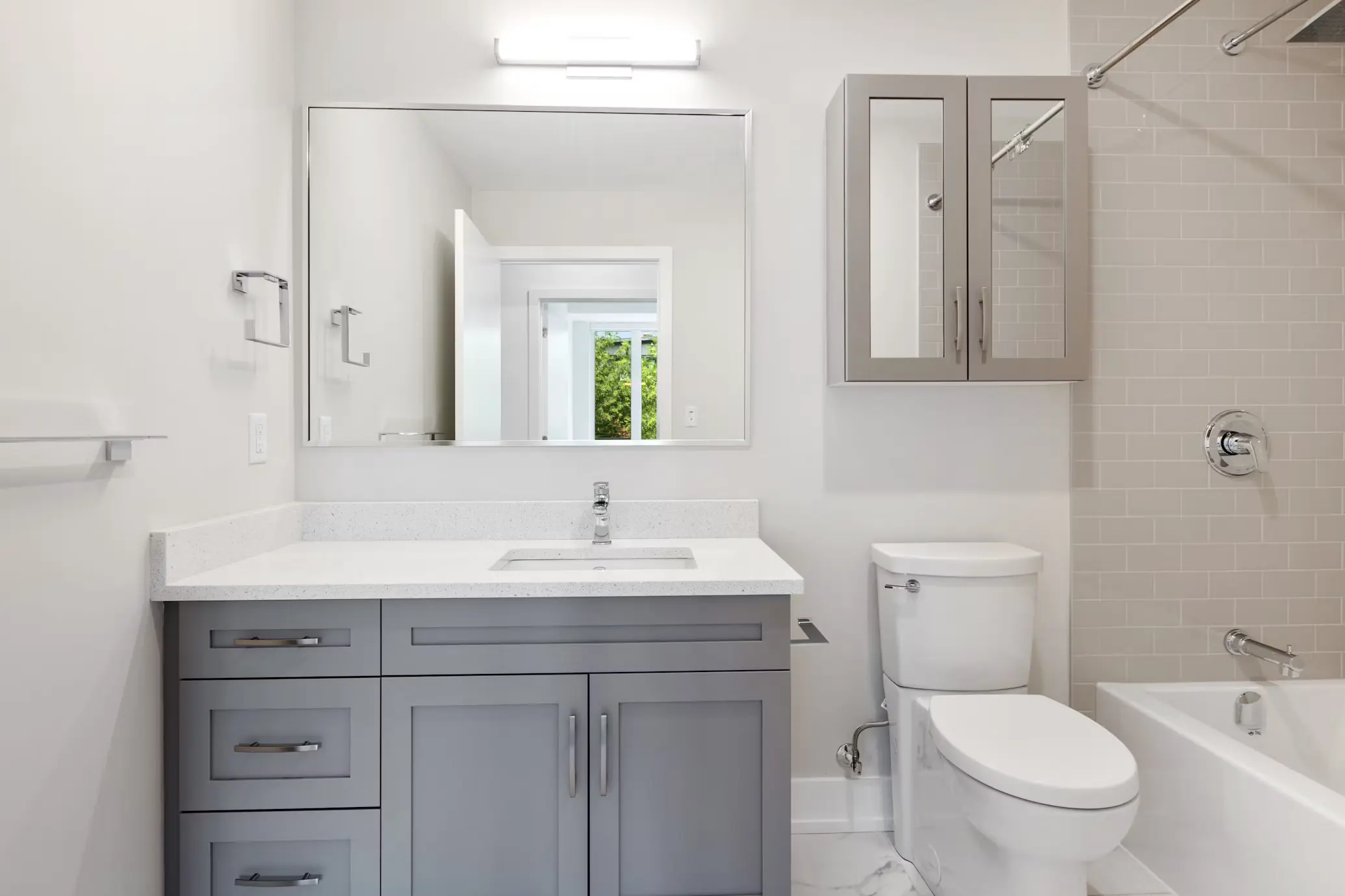 Updated bathroom with modern tile and fixtures