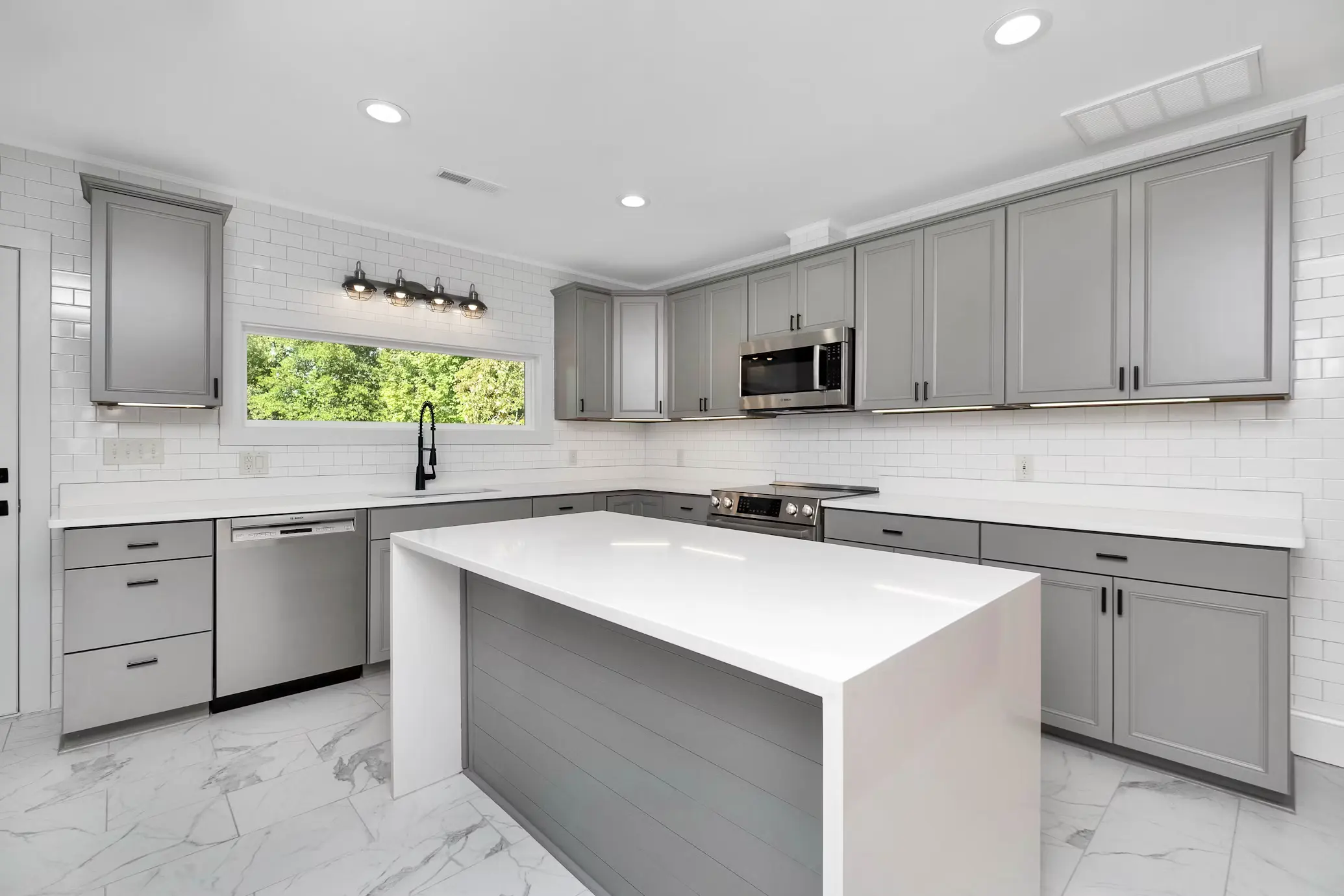 Remodeled kitchen with new cabinets and countertops